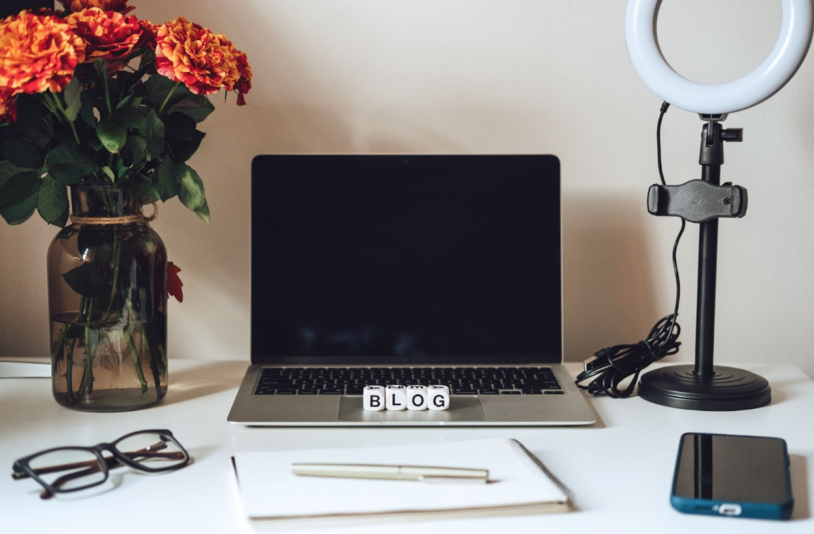 Blank laptop set up on a desk ready for blogging